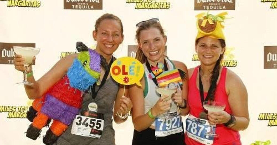Three women celebrating at the finish